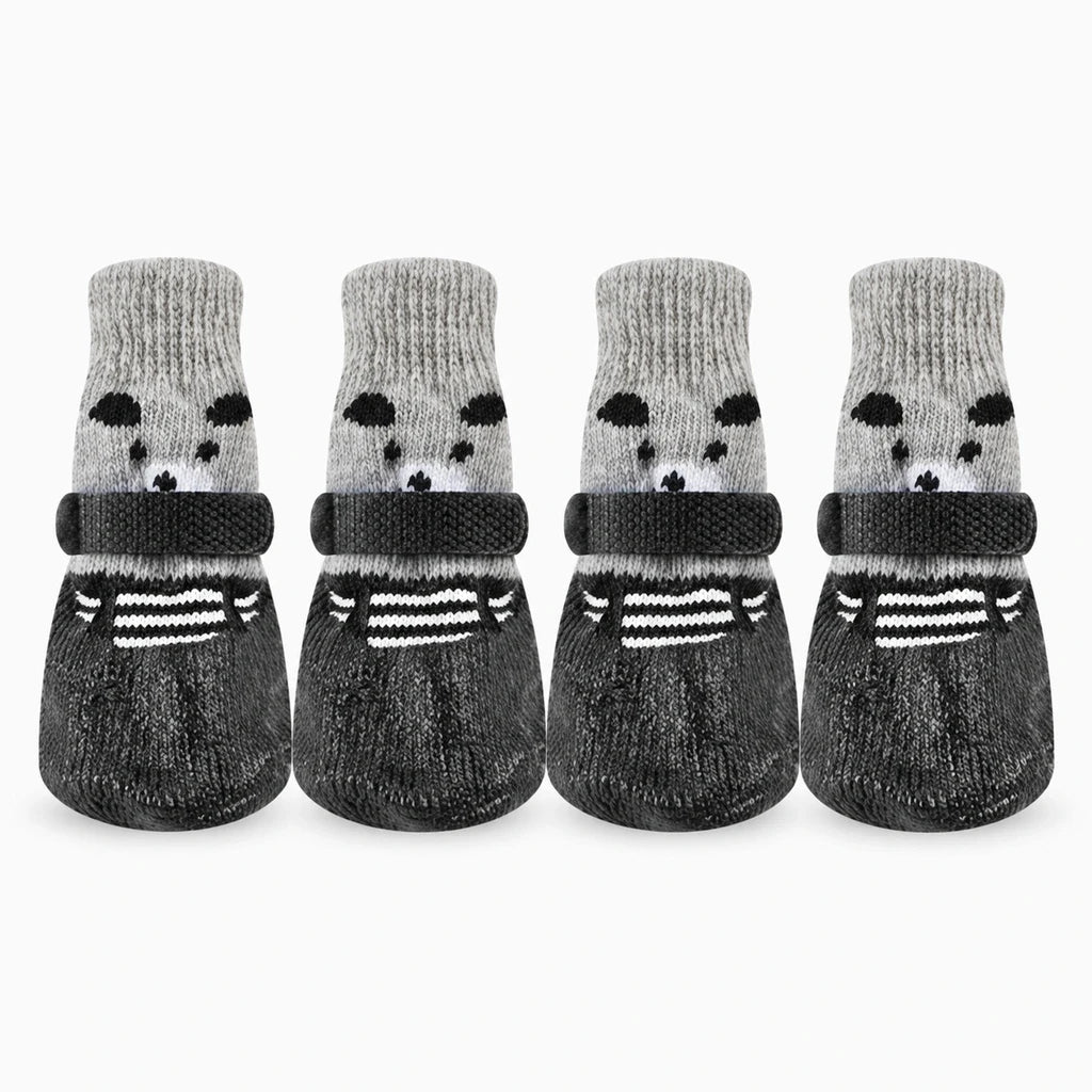 Chaussette neige chien noir vue de côté, matière souple épousant la forme de la patte