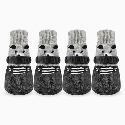 Chaussette neige chien noir vue de côté, matière souple épousant la forme de la patte
