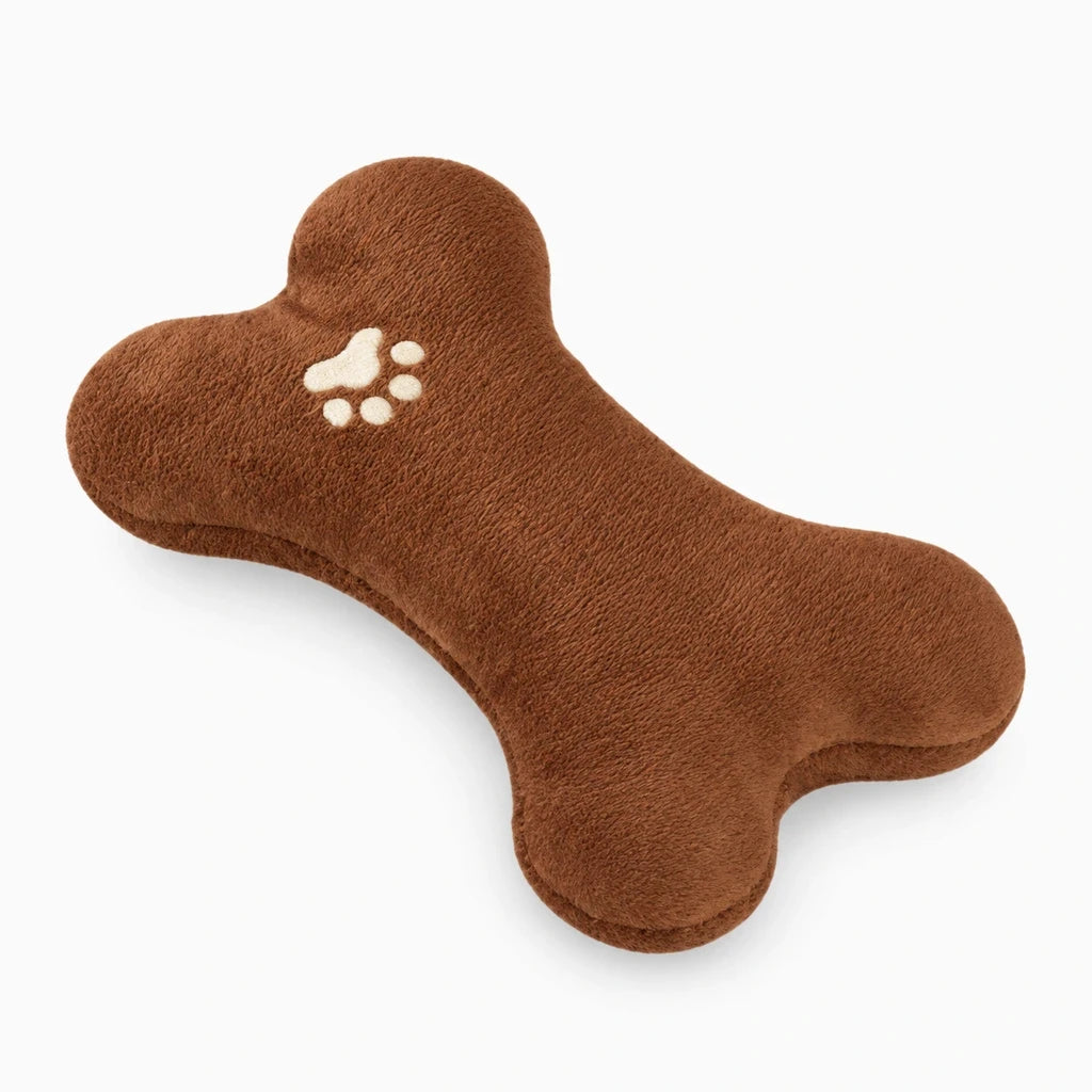 Coussin apaisant chien en forme d'os, texture peluche douce marron, idéal pour le repos et la détente