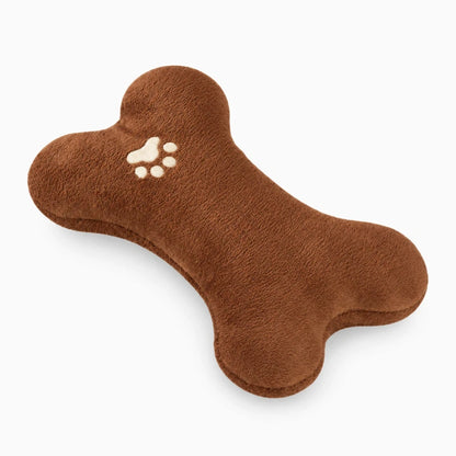 Coussin apaisant chien en forme d'os, texture peluche douce marron, idéal pour le repos et la détente