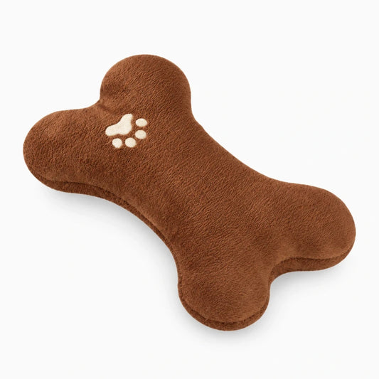 Coussin apaisant chien en forme d'os, texture peluche douce marron, idéal pour le repos et la détente