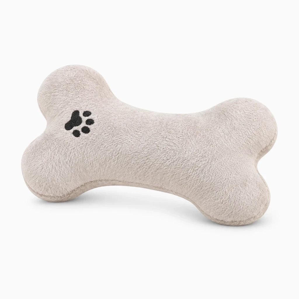 Coussin chien apaisant en peluche crème, design os ergonomique, coussin résistant aux morsures pour panier