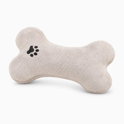 Coussin chien apaisant en peluche crème, design os ergonomique, coussin résistant aux morsures pour panier