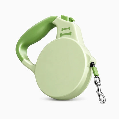 Détail du mécanisme de blocage et poignée ergonomique de la laisse rétractable, coloris vert