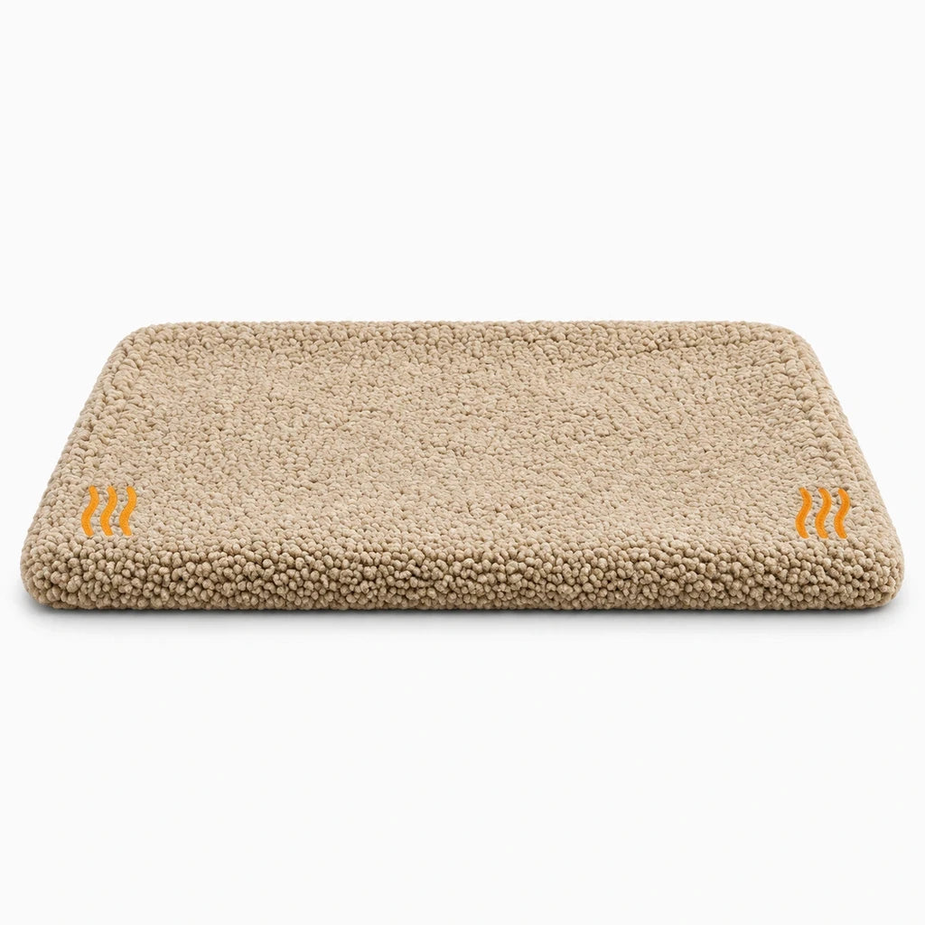 Coussin chauffant pour chien et chat avec base antidérapante, posé sur un rebord de fenêtre
