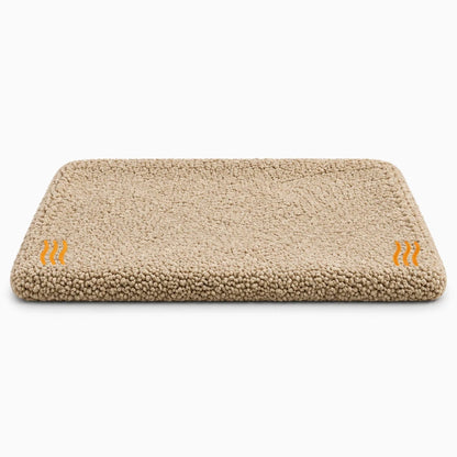 Coussin chauffant pour chien et chat avec base antidérapante, posé sur un rebord de fenêtre